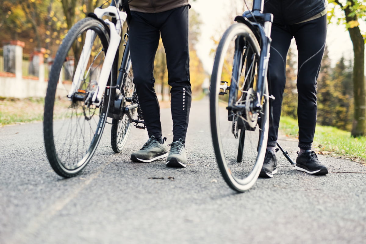 Man and Woman with Bikes on a Bicycle Tour