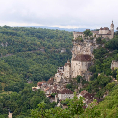 Bicycle Tours in Dordogne France couple of cyclists riding along a relaxed Tuscany road